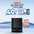 Black robot vacuum cleaner with top bin and circular cleaning base