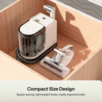 Compact spot cleaner with handheld tool and storage base, white design